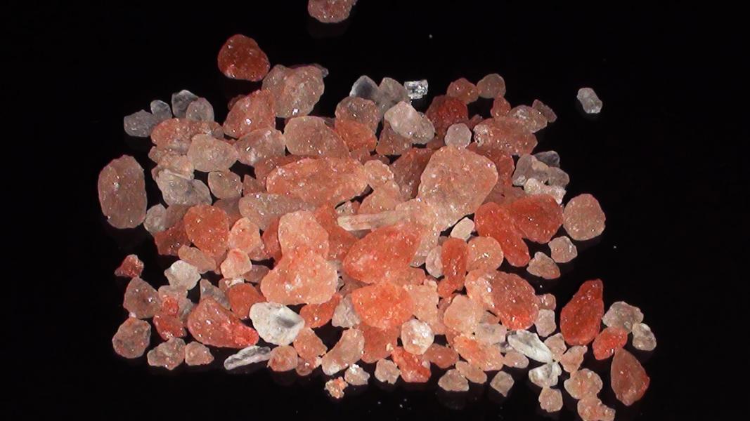 Closeup of coral-colored crystals.